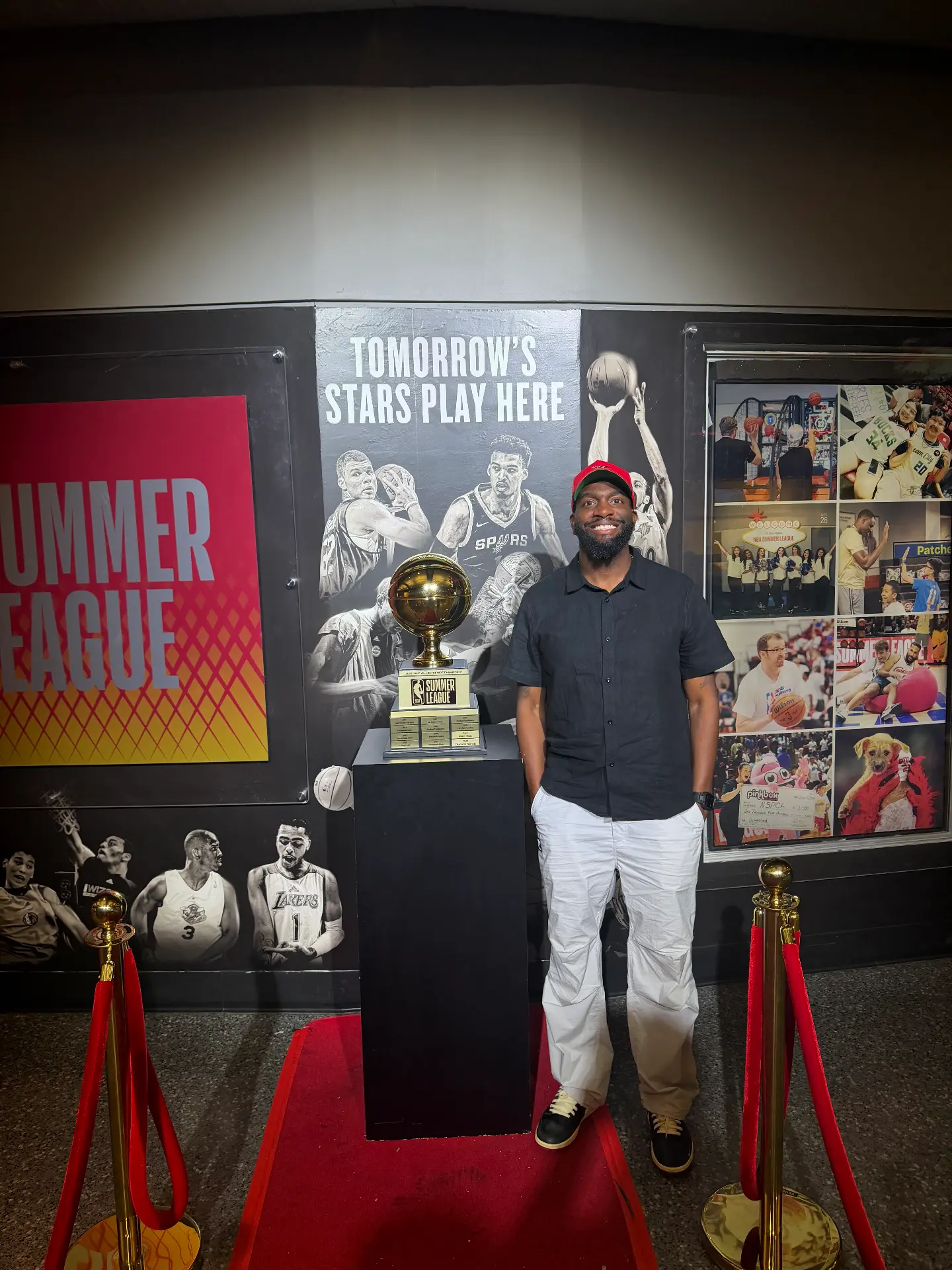Fred beside the NBA Summer League trophy