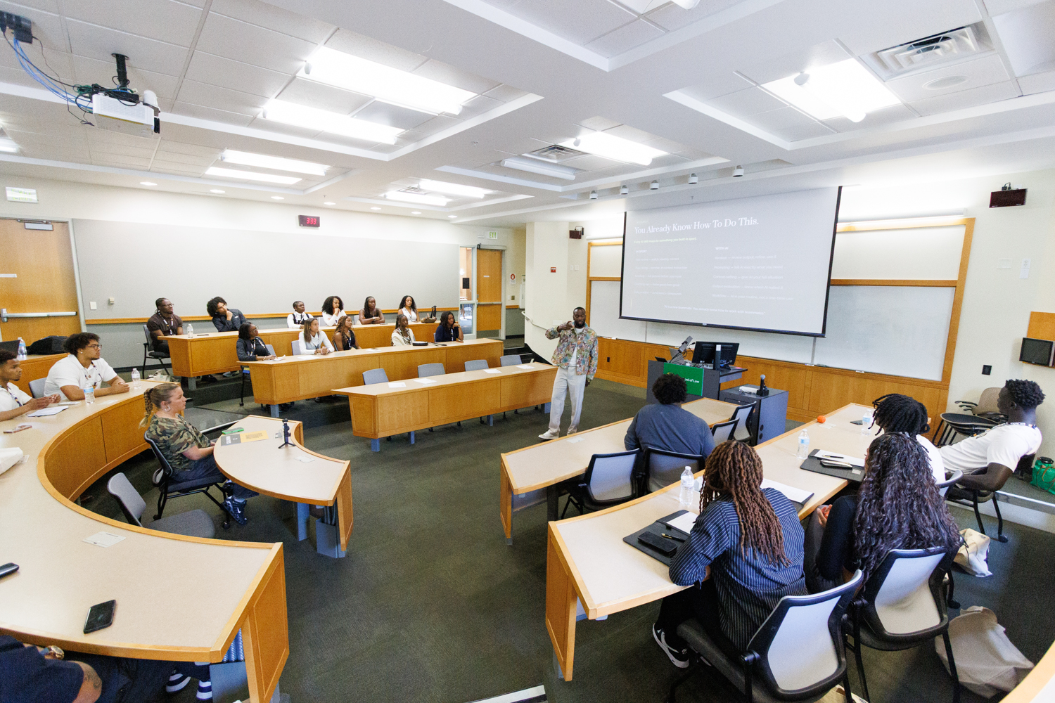 Fred presenting to a room of attendees