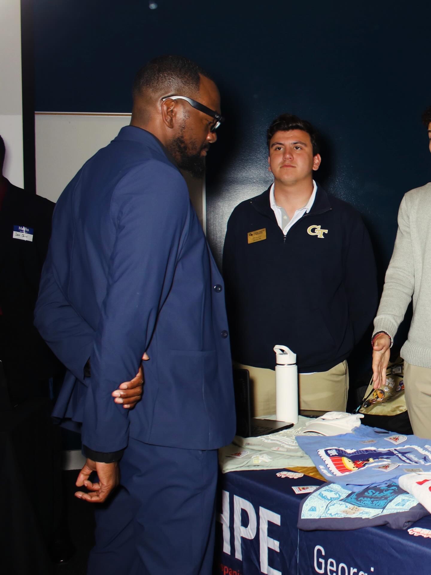 Fred speaking with attendees at a gathering